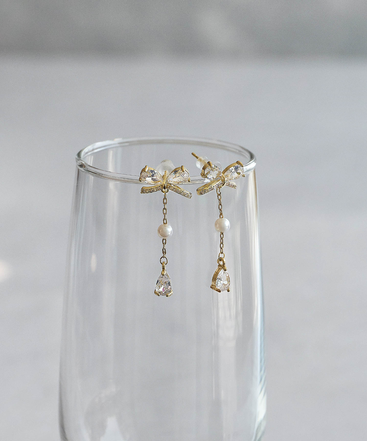 【COMING SOON】ビジューリボンパールスイングピアス
